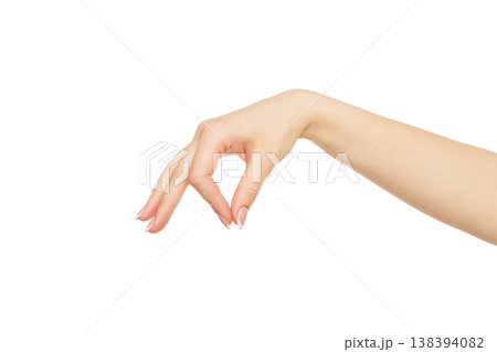 Female hand picking up some items isolated on white background, cutout, close up, copy space 138394082