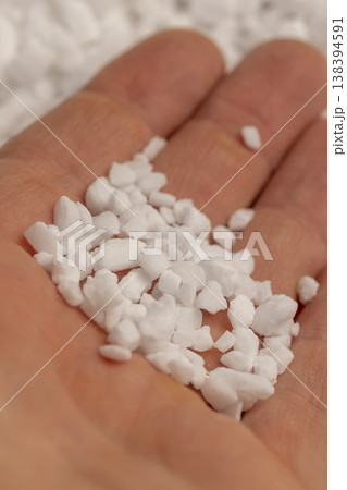 hold coarse solid salt that is used in dishwashers to improve and soften water, white coarse crystals of special salt for dishwashers for good and long-lasting dishwasher operation 138394591