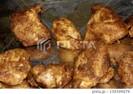 Close up of batterd deep fried golden chicken on foil Close up of batterd deep fried golden chicken on foil 138394879