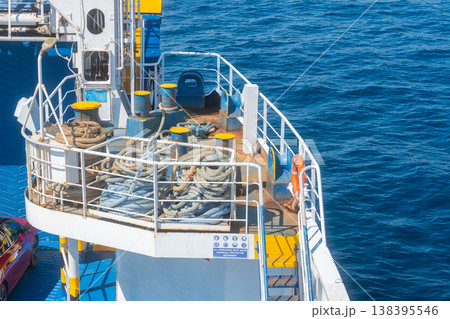 Upper deck of passenger ferry with railings and maritime equipment. Sea transportation and travel industry concept Upper deck of passenger ferry with railings and maritime equipment. Sea transportation and travel industry concept 138395546