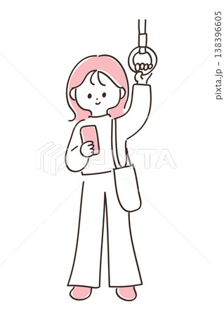 電車で吊り革を掴んでスマートフォンを見る若い女性 138396605