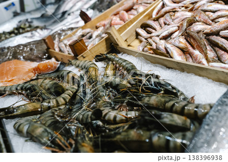 Fresh Shrimp and Fish Displayed on Ice at Seafood Market Fresh Shrimp and Fish Displayed on Ice at Seafood Market 138396938