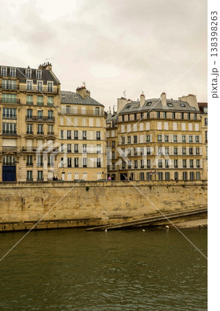 Haussmann architecture lining the Seine River embankment in Paris, France under an overcast sky 138398263