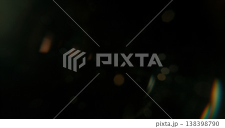 Abstract cinematic lens flare with bright light burst and star rays, isolated on black background. Optical light effect ideal for VFX overlays, transitions, titles and dramatic visual accents. 138398790