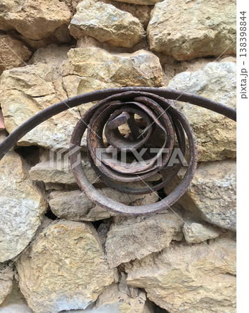 metal rings of various sizes on stone wall metal rings of various sizes on stone wall 138398844