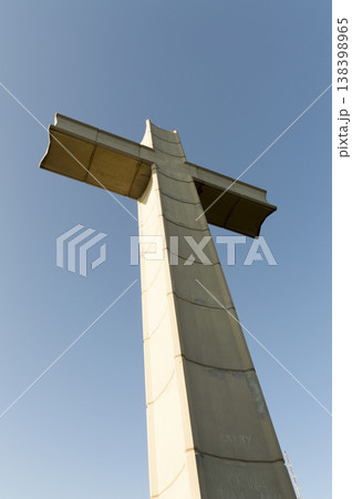 large concrete cross located at the top of the mountain 138398965