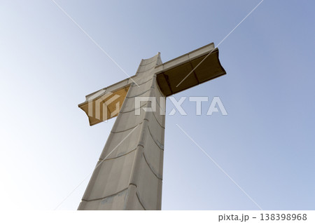 large concrete cross located at the top of the mountain 138398968
