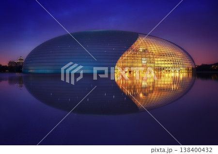 Sunset view of the National Center for the Performing Arts in Beijing with modern architecture reflecting warm evening light. 138400432