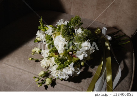Respectful White Floral Arrangement Accompanied By Greenery And Ribbon For Mourning Purposes 138400853