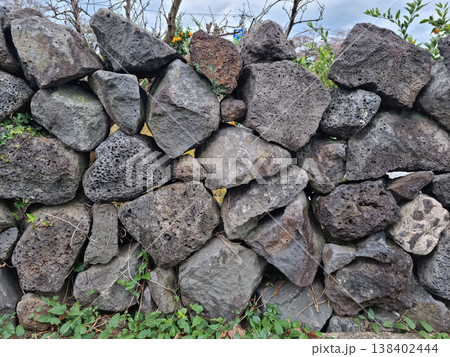 This is a stone wall made of basalt from Jeju Island. This is a stone wall made of basalt from Jeju Island. 138402444