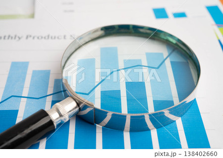 Magnifying glass on charts graphs paper. Financial development, Banking Account, Statistic, Investment Analytic research data economy. 138402660