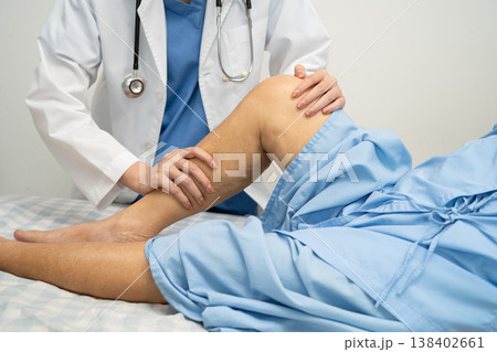 Doctor checking Asian elderly woman patient with scar knee replacement surgery in hospital. Doctor checking Asian elderly woman patient with scar knee replacement surgery in hospital. 138402661