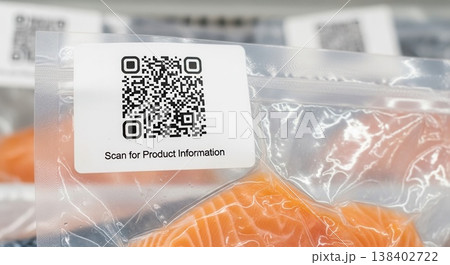 Fresh raw salmon fillets in vacuum-sealed plastic packaging featuring a prominent QR code for digital product information and traceability. Fresh raw salmon fillets in vacuum-sealed plastic packaging featuring a prominent QR code for digital product information and traceability. 138402722