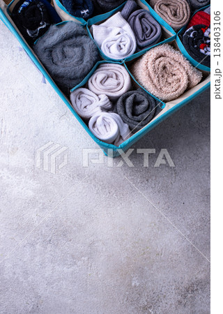 Decluttering concept. Organizing sock storage Decluttering concept. Organizing sock storage 138403106