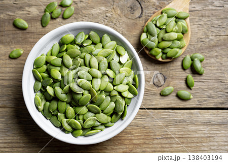 pumpkin seeds in bowl pumpkin seeds in bowl 138403194