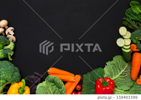 Fresh vegetables border on black background. Vegetarian cooking. Healthy natural food with copy space. 138403399