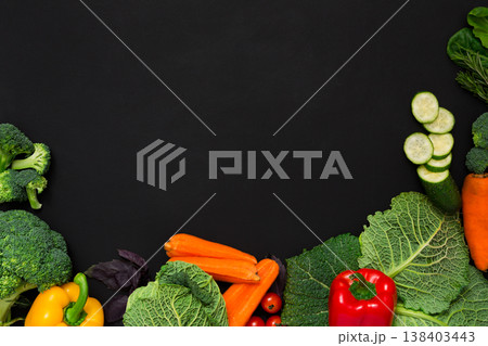 Fresh vegetables border on black background. Vegetarian cooking. Healthy natural food with copy space. 138403443
