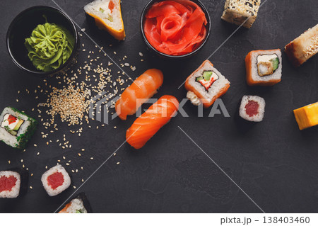 Sushi and rolls background closeup, top view, copy space. Colorful japanese restaurant food set Sushi and rolls background closeup, top view, copy space. Colorful japanese restaurant food set 138403460