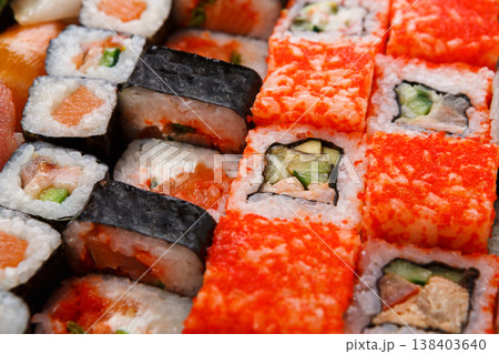 Sushi and rolls pattern background, japanese restaurant delivery top view. Salmon, unagi, california and other healthy meals 138403640