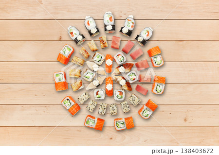 Japanese food restaurant, sushi california gunkan roll plate or platter set. Sushi at wooden planks background. Top view, flat lay. Big party sushi set. 138403672