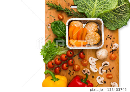 Healthy vegetarian food delivery background. Fresh organic vegetables and lunch box isolated on white. 138403743