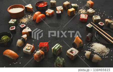 Sushi and rolls background, frame on black. Colorful japanese restaurant food set, copy space Sushi and rolls background, frame on black. Colorful japanese restaurant food set, copy space 138403815
