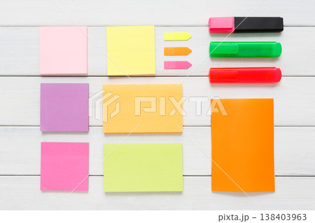 Flat lay of office and business stationery supplies - colorful markers, sticky notes and memo blocks, notepad, pen on white rustic wooden board background, top view with copy space, nobody, objects Flat lay of office and business stationery supplies - colorful markers, sticky notes and memo blocks, notepad, pen on white rustic wooden board background, top view with copy space, nobody, objects 138403963