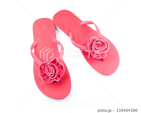 Red summer beach flip flops on a white isolated background. Red summer beach flip flops on a white isolated background. 138404366
