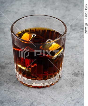 A whiskey glass with reusable steel cooling cubes A whiskey glass with reusable steel cooling cubes 138404507