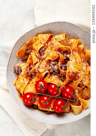 pappardelle pasta with bolognese sauce, topped with parmesan cheese and cherry branch, homemade, no people, pappardelle pasta with bolognese sauce, topped with parmesan cheese and cherry branch, homemade, no people, 138404582