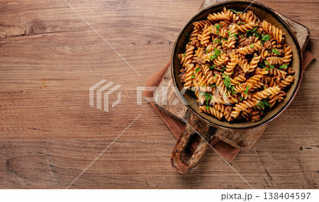 pasta in the navy, pasta with minced meat, plate on a wooden table, homemade, fusilli pasta, without people, pasta in the navy, pasta with minced meat, plate on a wooden table, homemade, fusilli pasta, without people, 138404597