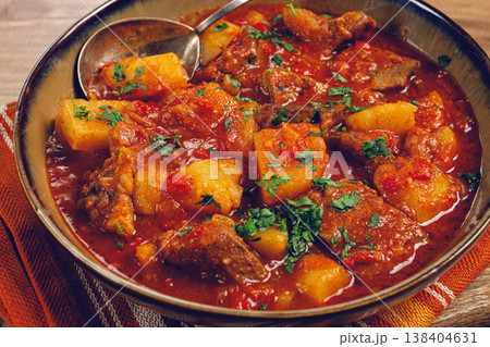 Potatoes with meat, stewed in tomato sauce, with spices and herbs, homemade, no people, 138404631