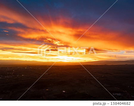 Aerial view of city at golden hour, colorful sunset sky, urban silhouette Aerial view of city at golden hour, colorful sunset sky, urban silhouette 138404682