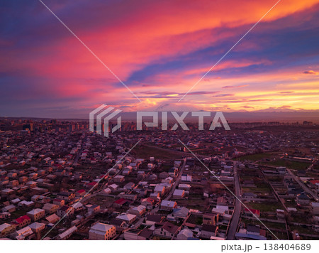 Sky paints city with hues of pink, orange, and purple at dusk Sky paints city with hues of pink, orange, and purple at dusk 138404689