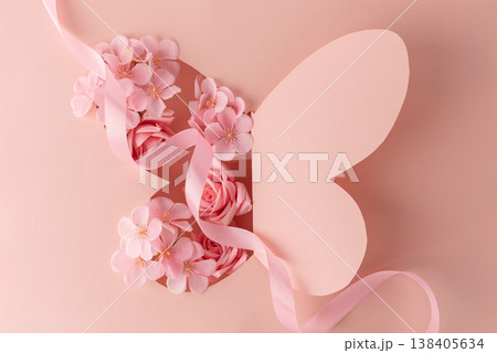 Paper Butterfly Cut Out with Flowers on Pink Background 138405634