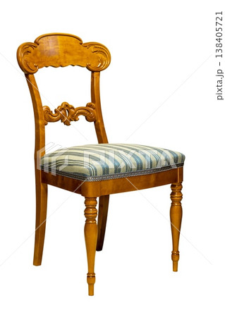 Elegant wooden chair with striped fabric sitting in a cozy room bringing charm and comfort 138405721