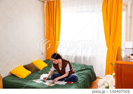 Caucasian woman balancing financial accounts checking bills and structuring a long-term investment plan. concept of economy and budgeting for success. Wide shot, copy space Caucasian woman balancing financial accounts checking bills and structuring a long-term investment plan. concept of economy and budgeting for success. Wide shot, copy space 138407508