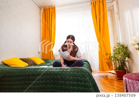 Caucasian woman checking her financial documents and planning investments for passive income. concept of economy and wealth building. Low angle view. Wide shot Caucasian woman checking her financial documents and planning investments for passive income. concept of economy and wealth building. Low angle view. Wide shot 138407509