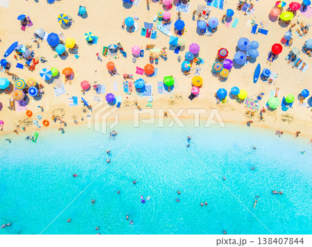 Aerial drone view of Balearic Islands, Mallorca, Spain. People and umbrellas on beach.  138407844