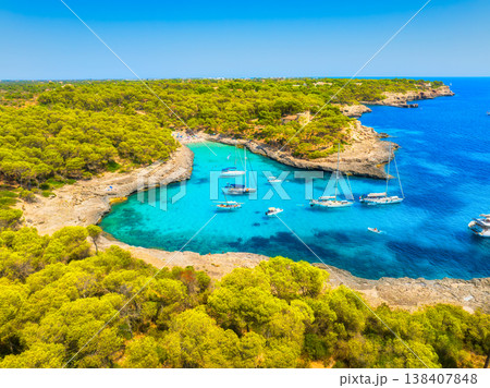 High angle aerial drone view of a scenic Mediterranean bay in Mallorca, Spain. High angle aerial drone view of a scenic Mediterranean bay in Mallorca, Spain. 138407848