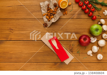 Border of fresh organic vegetables, fruits and nuts on rustic wood background. Healthy natural food on table with copy space. Cooking ingredients top view, mockup for recipe or menu Border of fresh organic vegetables, fruits and nuts on rustic wood background. Healthy natural food on table with copy space. Cooking ingredients top view, mockup for recipe or menu 138408604