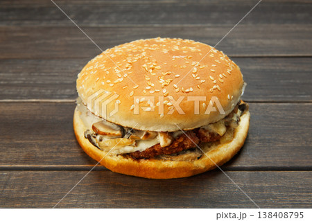 Classic american burger fast food. Big double burger at wood. Hamburger with fresh vegetables and meat. Burger with cheese, beef, tomato, lettuce. Cheeseburger at rustic wooden background. Classic american burger fast food. Big double burger at wood. Hamburger with fresh vegetables and meat. Burger with cheese, beef, tomato, lettuce. Cheeseburger at rustic wooden background. 138408795