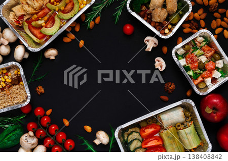 Healthy restaurant food delivery background with copy space. Mockup for menu, foil containers with meals on black 138408842