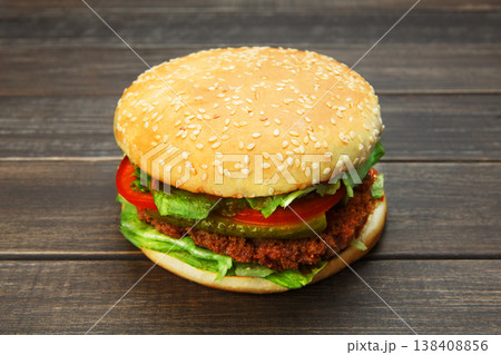 Classic american burger fast food. Big double burger at wood. Hamburger with fresh vegetables and meat. Burger with cheese, beef, tomato, lettuce. Cheeseburger at rustic wooden background. Classic american burger fast food. Big double burger at wood. Hamburger with fresh vegetables and meat. Burger with cheese, beef, tomato, lettuce. Cheeseburger at rustic wooden background. 138408856