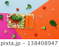 Vegetables on colorful abstract background. Healthy eating and diet. Cut raw vegetables on wooden board, copy space. Ingredients for salad or soup - mushroom, cherry tomato, broccoli, cucumber, carrot 138408947