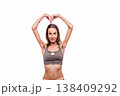 Woman showing heart shape with emaciated arms 138409292