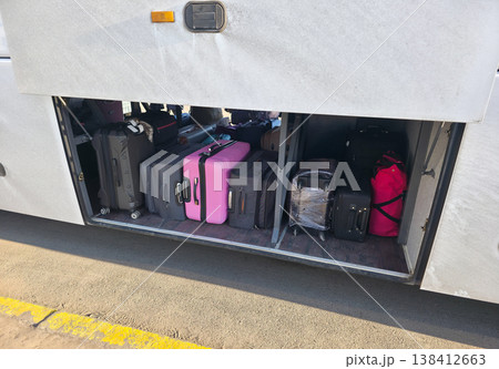 Luggage for travel in the bus luggage compartment. Traveling with the whole family. Bus trips with luggage. . High quality photo Luggage for travel in the bus luggage compartment. Traveling with the whole family. Bus trips with luggage. . High quality photo 138412663