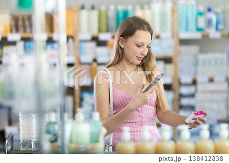 Young woman scanning qr code of paracetamol 138412838
