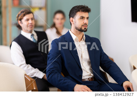 Lecture or meeting participants listen to speaker Lecture or meeting participants listen to speaker 138412927