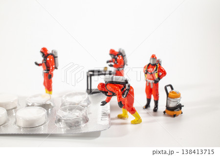 Miniature hazmat team inspecting oversized USB cable Miniature hazmat team inspecting oversized USB cable 138413715